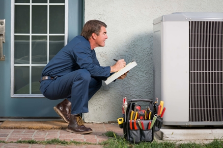 HVAC specialist evaluating an outdoor air system